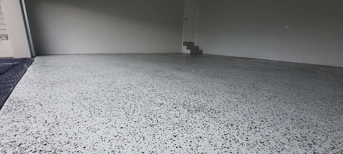 Finished flake epoxy garage floor by Floor Candy